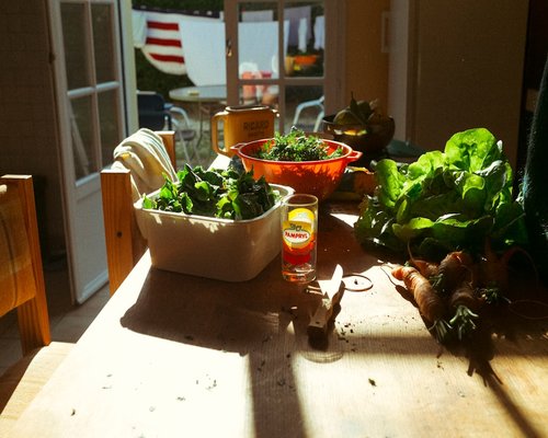 Healthy vegetables and water on kitchen table
